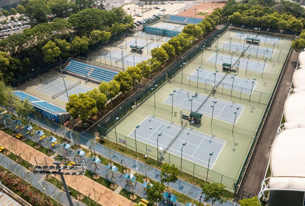 Multi-court tennis facility with commercial LED lighting system